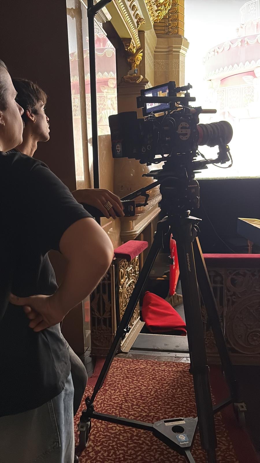 Camera operator in a theatre box